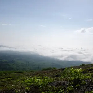 View towards Chitose and Tomakomai with Mount Tarumae in the background. Sea of clouds covers the city